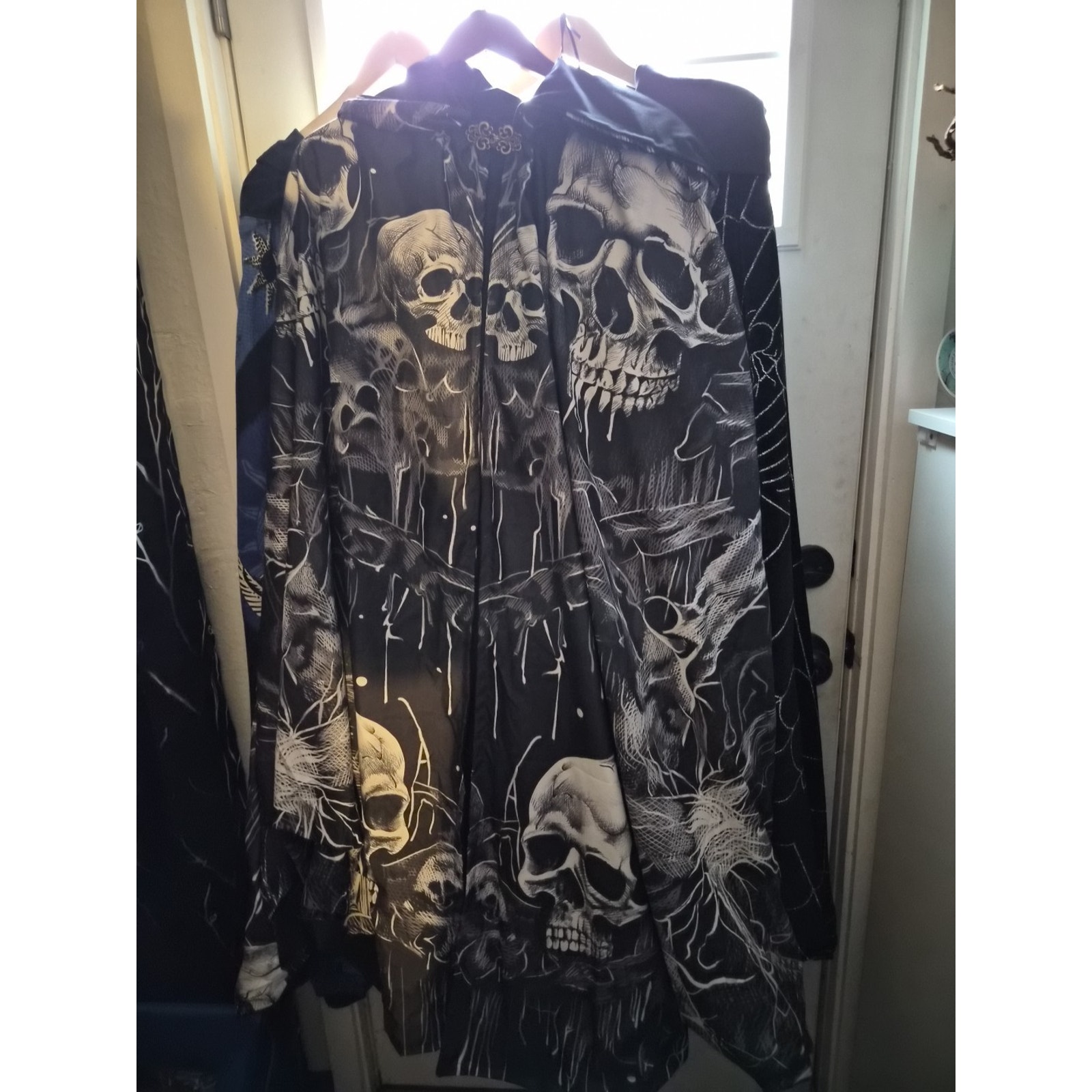 Black And White Hooded C Loak With Skulls It Is Made From T A Pestries And Lined